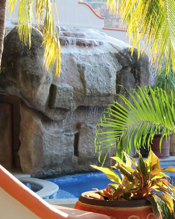Stone waterfall by the pool